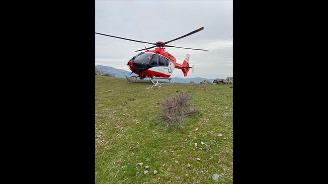 İzmir de kayalıklara düşen kadına helikopterli yardım